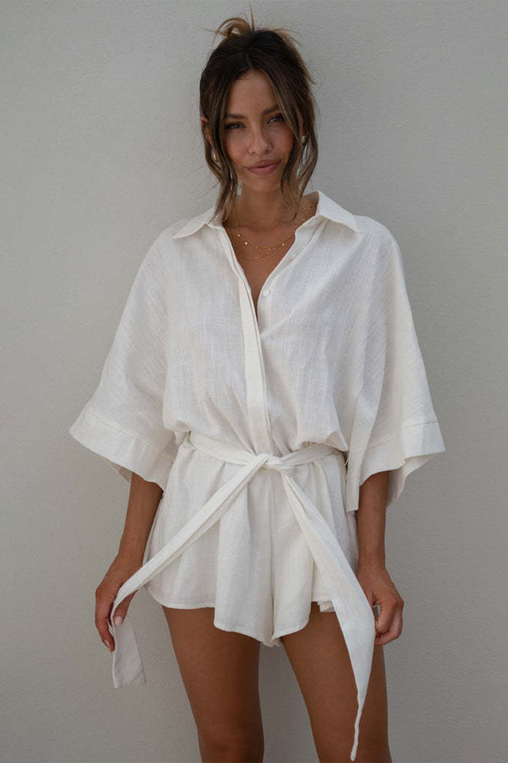 White linen kimono sleeve romper with tie waist and collar