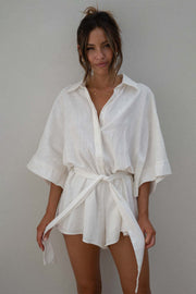 White linen kimono sleeve romper with tie waist and collar
