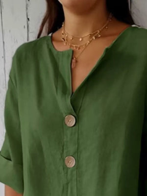 Dark green button-down shirt with relaxed fit and wooden buttons.