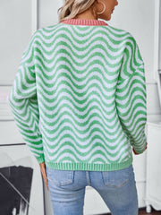 Wavy stripe knit sweater in Gum Leaf green and white with pink contrast collar.