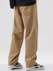 Khaki cotton pants with a relaxed fit and casual styling, showing back pockets.