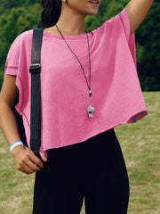 Pink t-shirt with exposed seams and a cutout back detail.