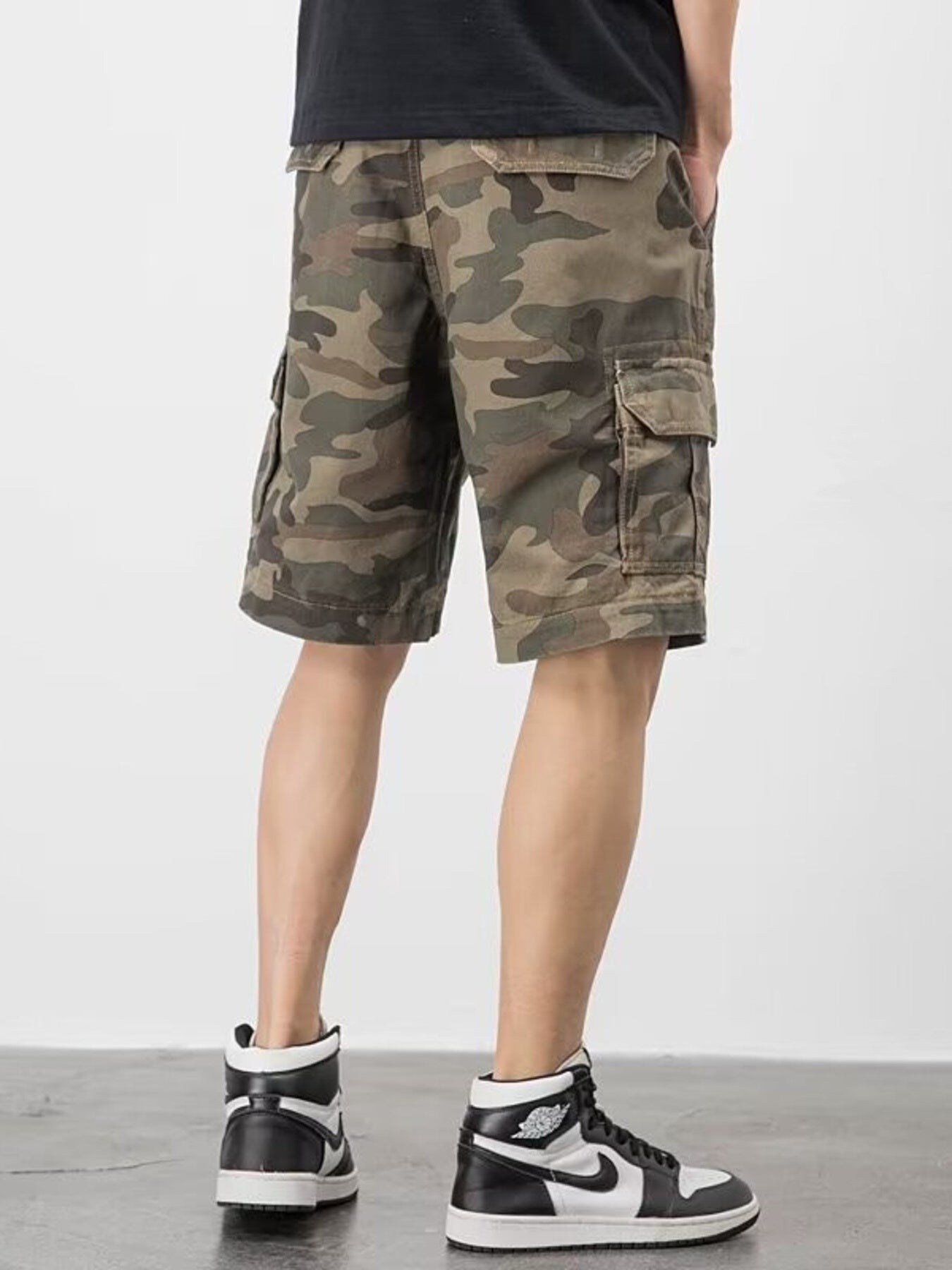 Men's plus-size cargo shorts in camo pattern with relaxed fit and multiple pockets.
