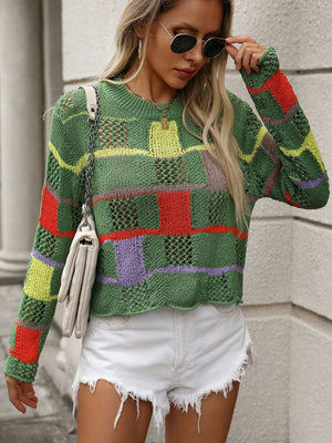 Green openwork knit sweater with colorful patchwork blocks and stripes, crew neck, long sleeves.