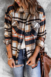 Soft plaid shacket with patch pockets and button front, styled with denim.