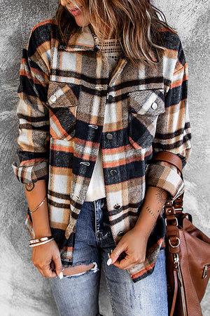 Soft plaid shacket with patch pockets and button front, styled with denim.