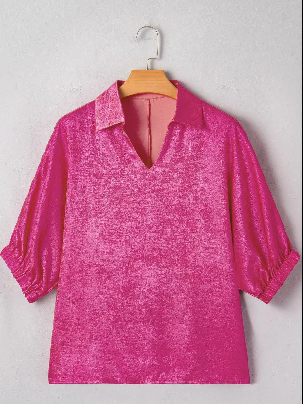 Lustrous collared V-neck maternity shirt in deep rose, 100% polyester, with cinched cuffs.