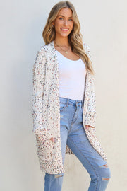 Confetti knit open-front cardigan in ivory with colorful speckles and pockets.