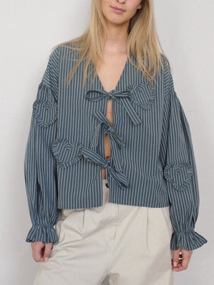 Stripe blouse with tie front, ruffled heart appliqués and balloon sleeves.