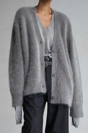 Dark gray angora button cardigan with sculpted sleeves over a v-neck top.