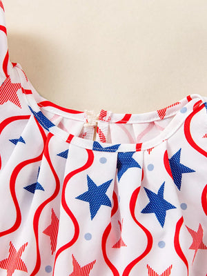 Toddler dress with red and blue stars and wavy stripes, featuring ruffle sleeves and a gathered neckline.