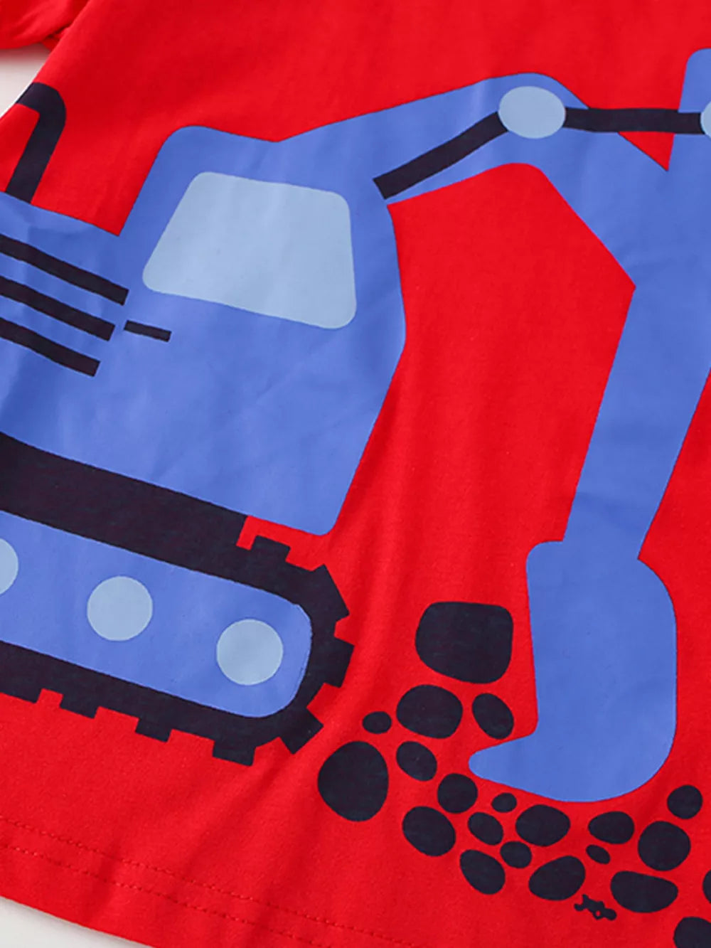 Red cotton toddler t-shirt with a blue excavator graphic and black dirt detail.