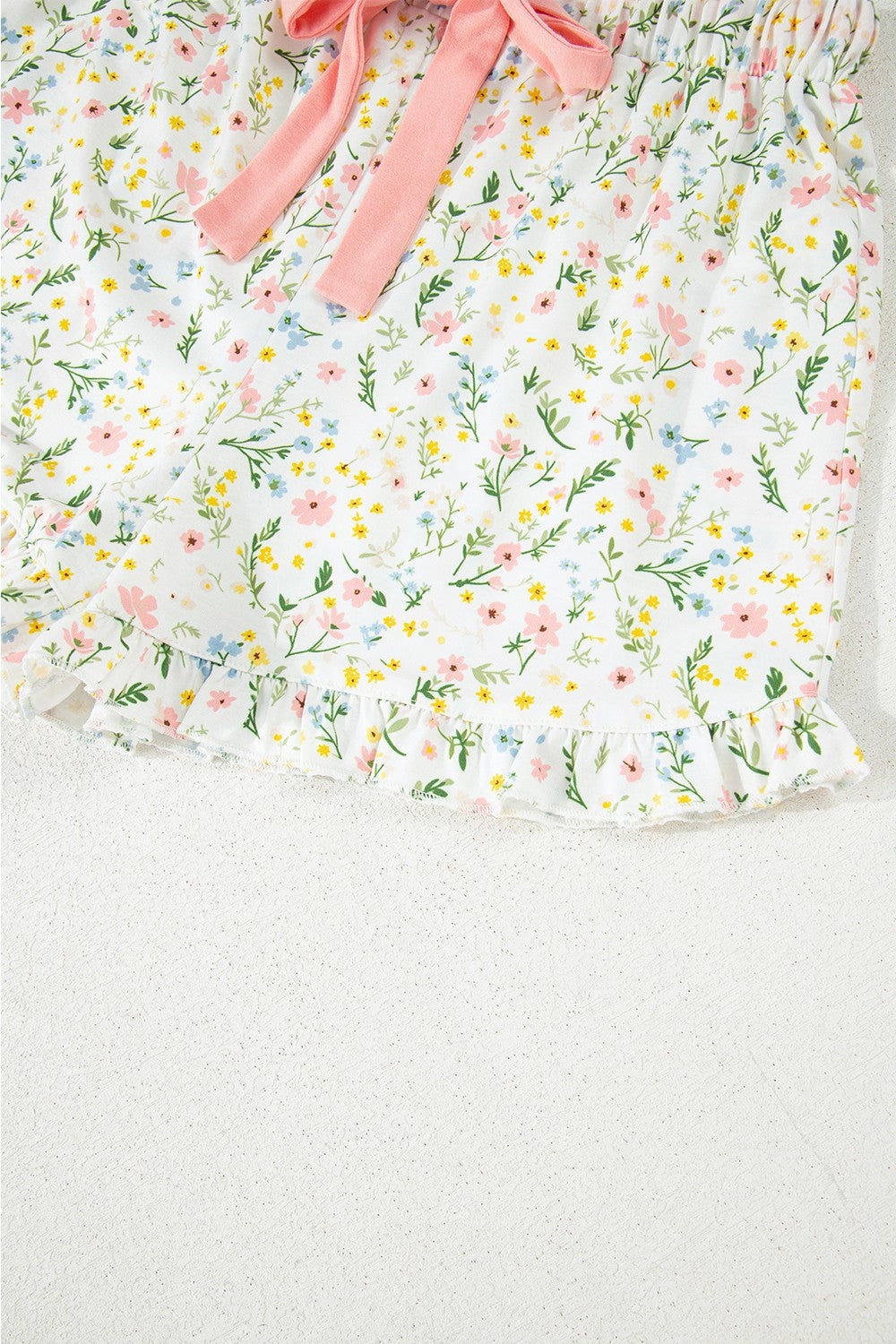 Floral print pajama shorts with ruffle hem and pink bow detail
