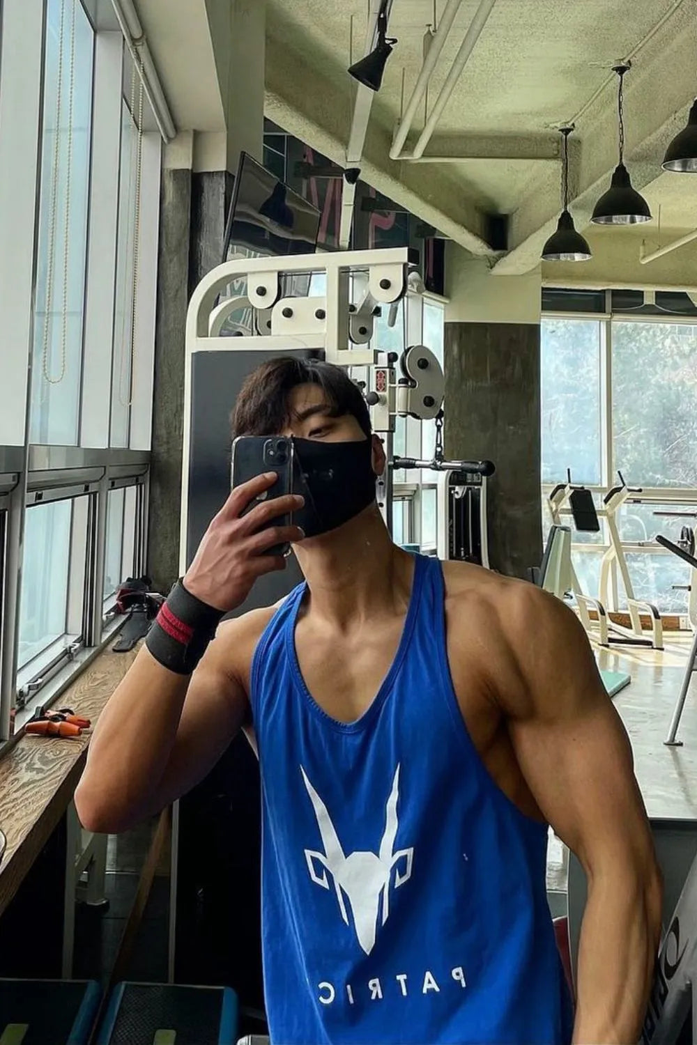 Royal blue performance tank top with white graphic logo and text detail