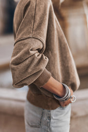 Acid wash taupe mock neck sweatshirt with ribbed cuffs and hem.
