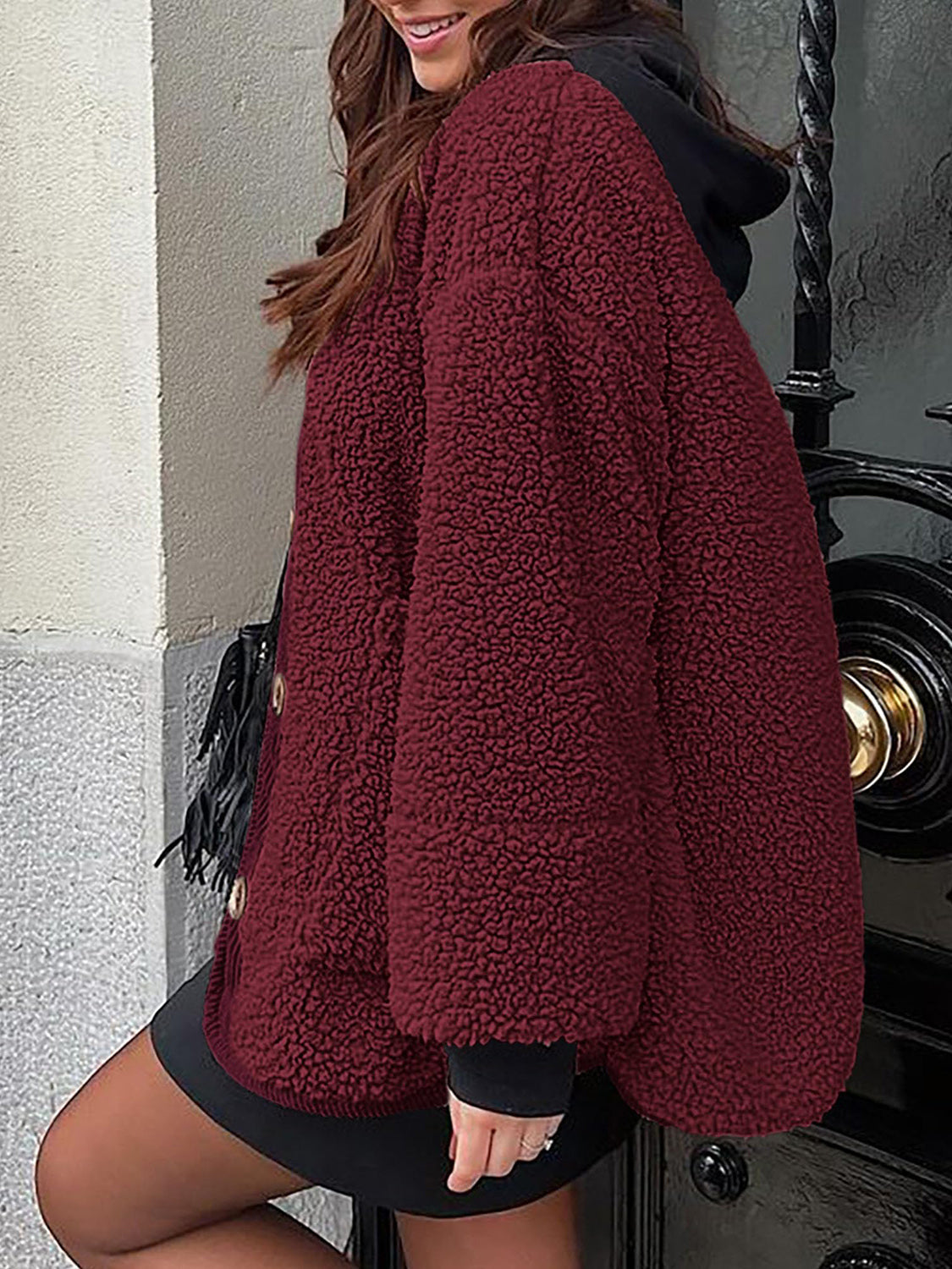 Burgundy teddy-texture button-up jacket with corduroy trim and black hoodie.