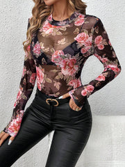 Black mesh bodysuit with long sleeves and a floral rose print, featuring a high neckline.