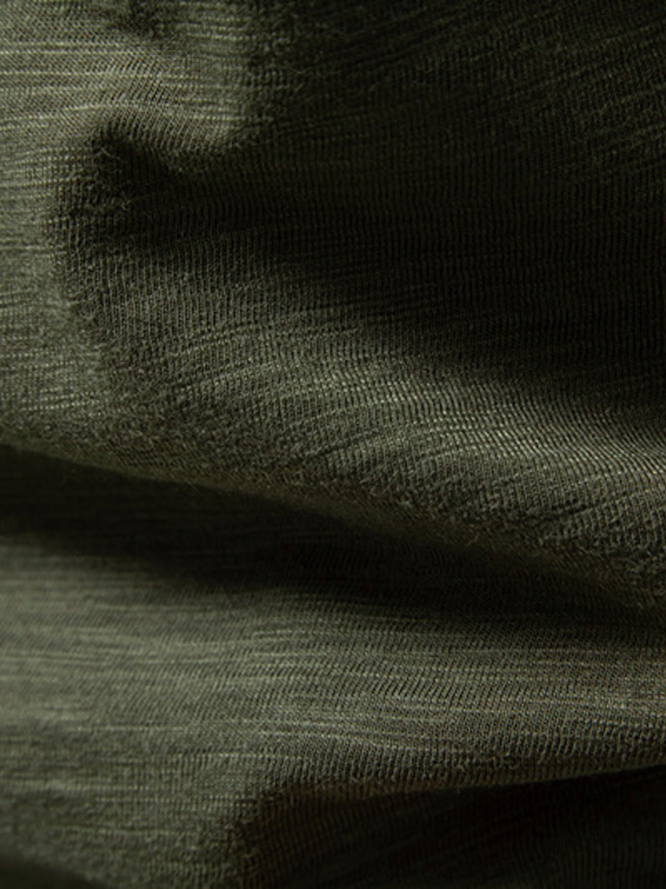 Men's Army Green cotton blend t-shirt with a textured weave and curved hem detail.