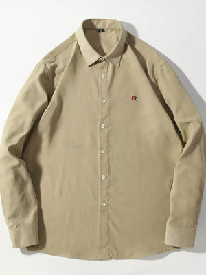 Khakis button-up shirt with red embroidered logo detail on chest