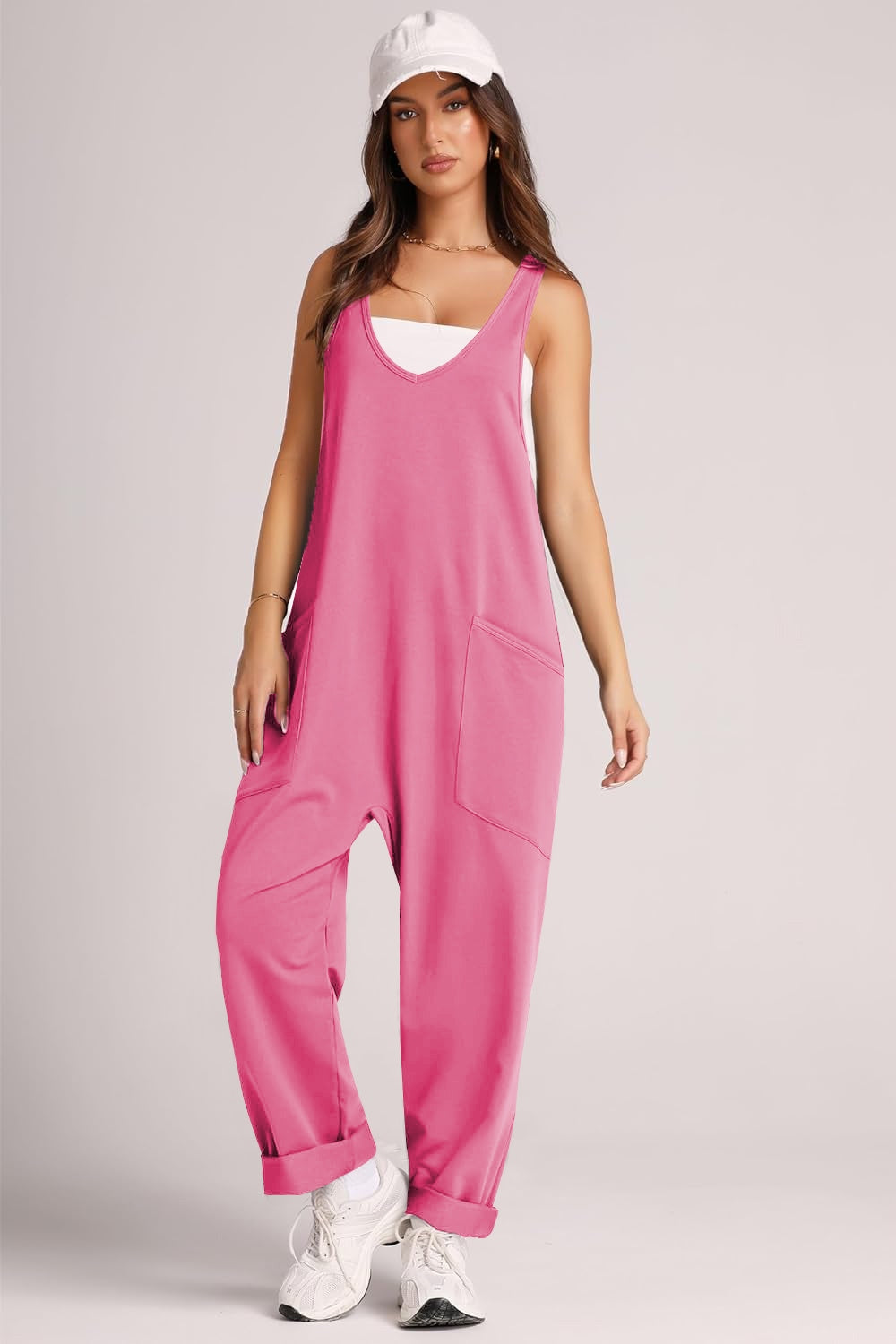 Relaxed fit hot pink jumpsuit with oversized pockets and cuffed ankles.