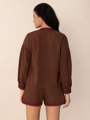 Brown linen pajama set with scallop trim on neckline and shorts.
