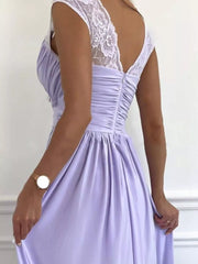 Lavender maxi dress with lace accents on the shoulders and back, featuring ruching.