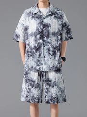 Men's tie-dye pleated casual set in dark navy with short sleeves and drawstring shorts.