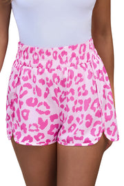 Pink leopard print shorts with elastic waistband and scalloped hem