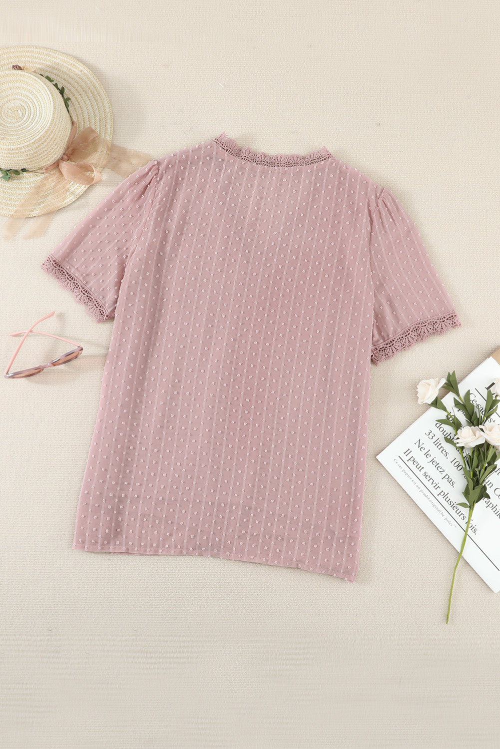 Dusty pink dotted swiss blouse with lace trim neckline and sleeves.