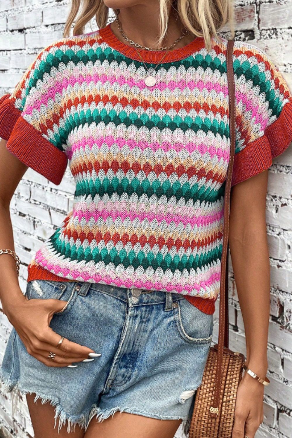 Textured knit sweater with colorful stripes and contrast trim sleeves and neckline.