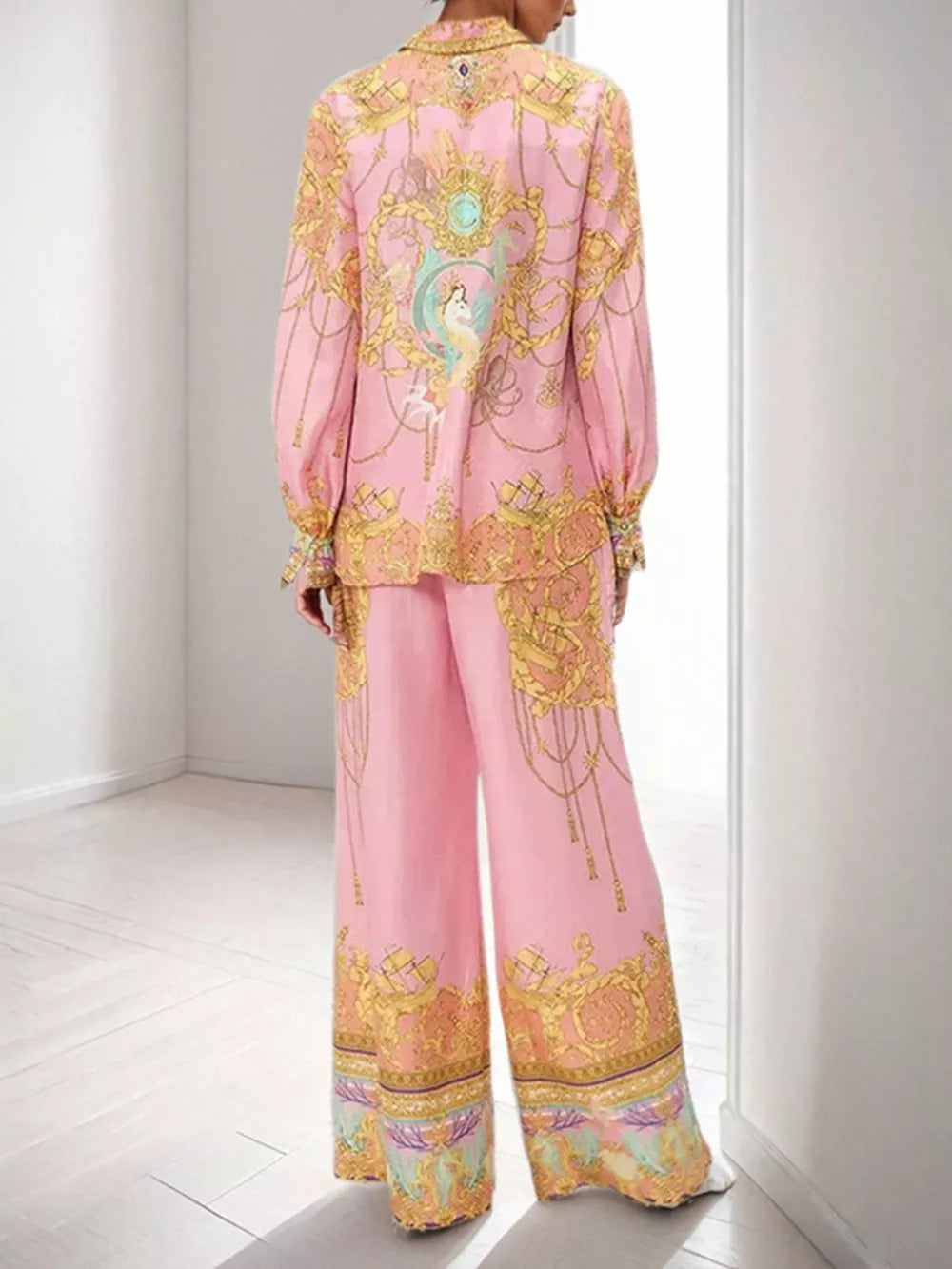 Pink baroque print two-piece set with lantern sleeves and wide-leg pants.