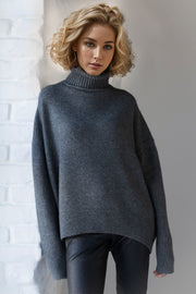 Oversized dark gray cashmere turtleneck sweater with ribbed cuffs and hem.