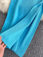 Light blue ribbed knit midi dress with a side slit detail.