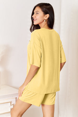 Yellow bamboo loungewear set with relaxed fit tee and shorts, featuring a chest pocket.