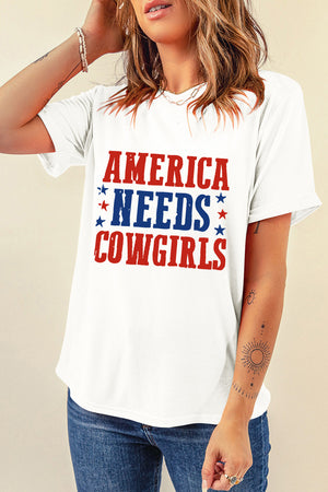 White graphic t-shirt with red and blue "America Needs Cowgirls" text and stars.