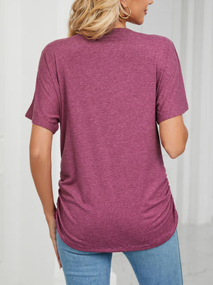 Burgundy relaxed V-neck short sleeve t-shirt with ruched sides.