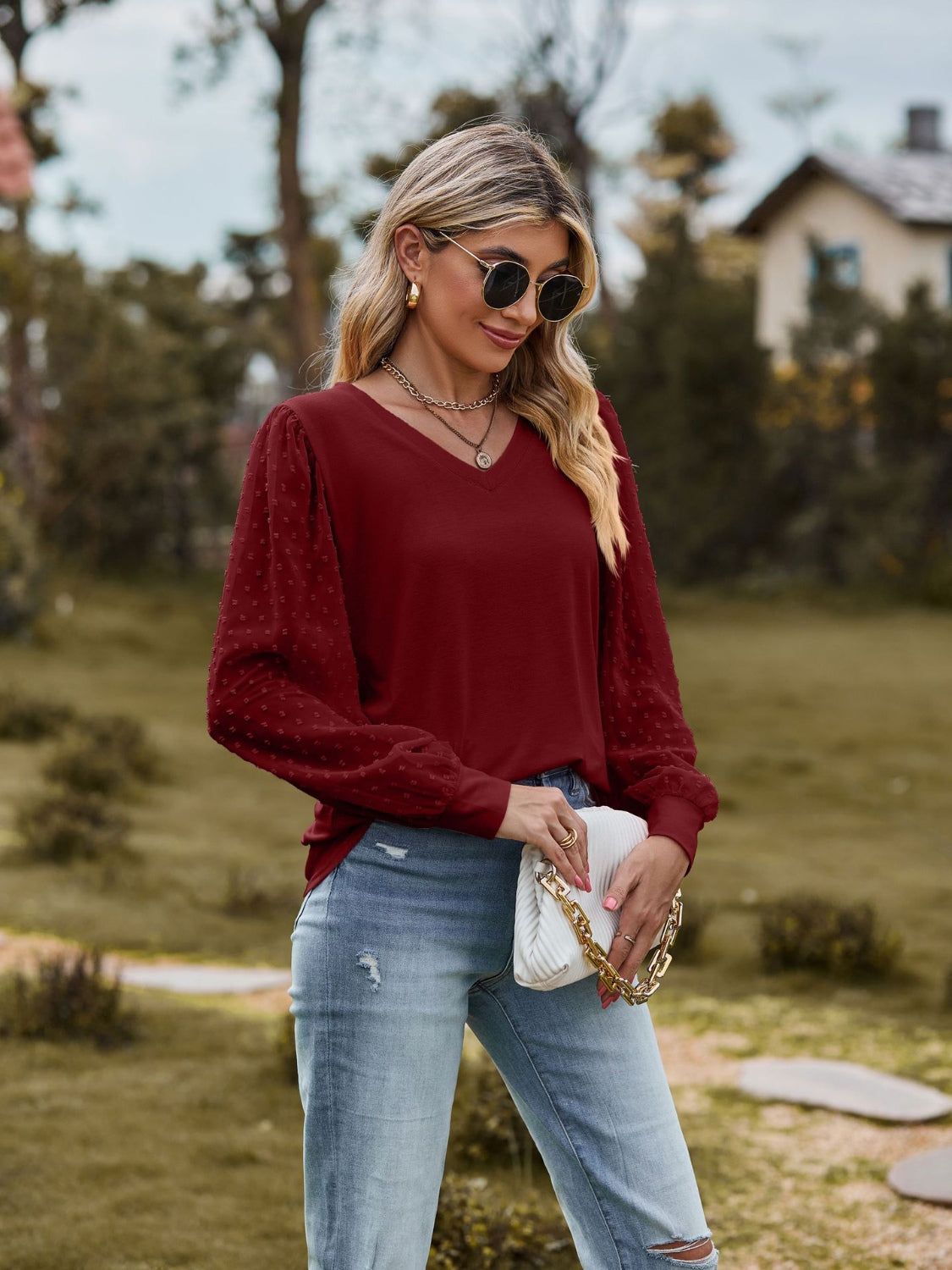 Burgundy Swiss dot sleeve V-neck blouse with bishop sleeves.