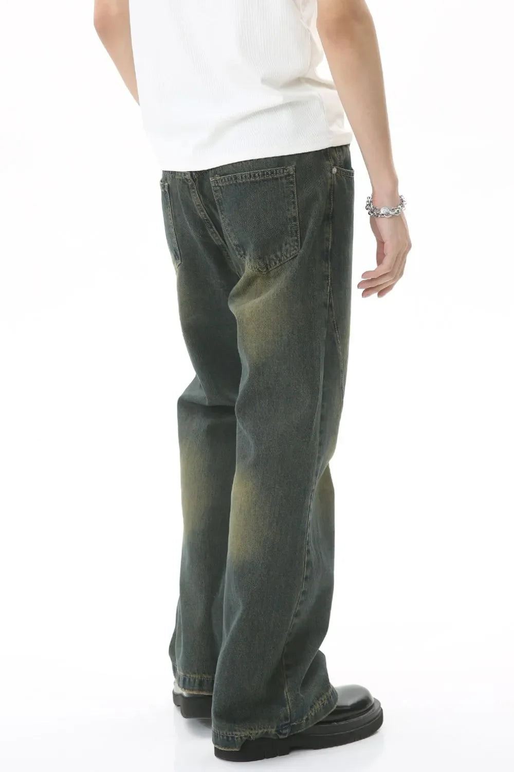 Faded wash flare denim jeans in dark, with a relaxed fit and subtle whiskering.