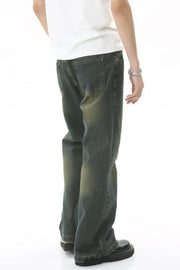 Faded wash flare denim jeans in dark, with a relaxed fit and subtle whiskering.
