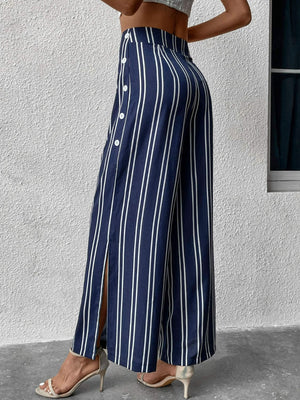 Dark blue vertical stripe palazzo trousers with side slit and button detail.