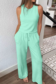 Mint green drawstring lounge set with sleeveless top and wide-leg pants with pockets.