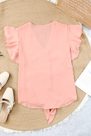 Peach tie-front blouse with ruffle sleeves and V-neck.