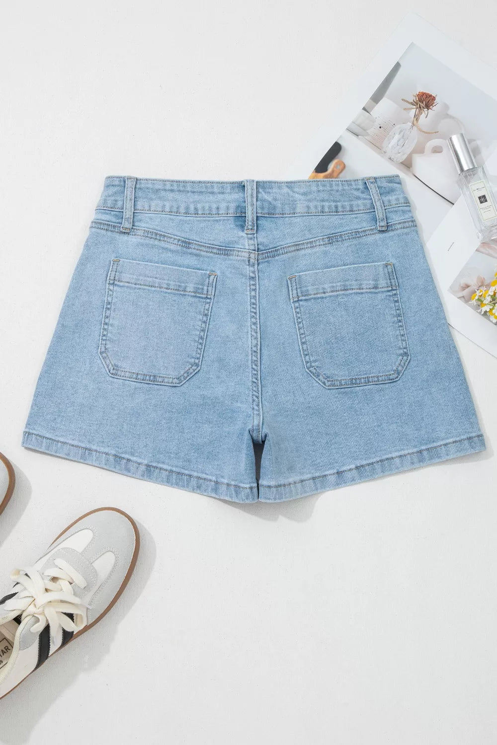 Light wash denim shorts with high rise and patch pockets