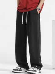 Men's black sweatpants with drawstring waist and wide leg