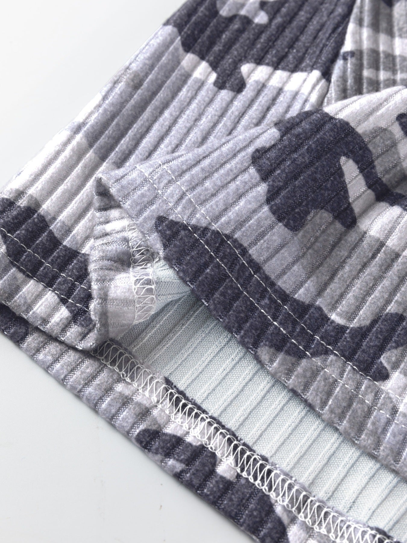 Gray ribbed knit camouflage tank top with visible stitching detail.