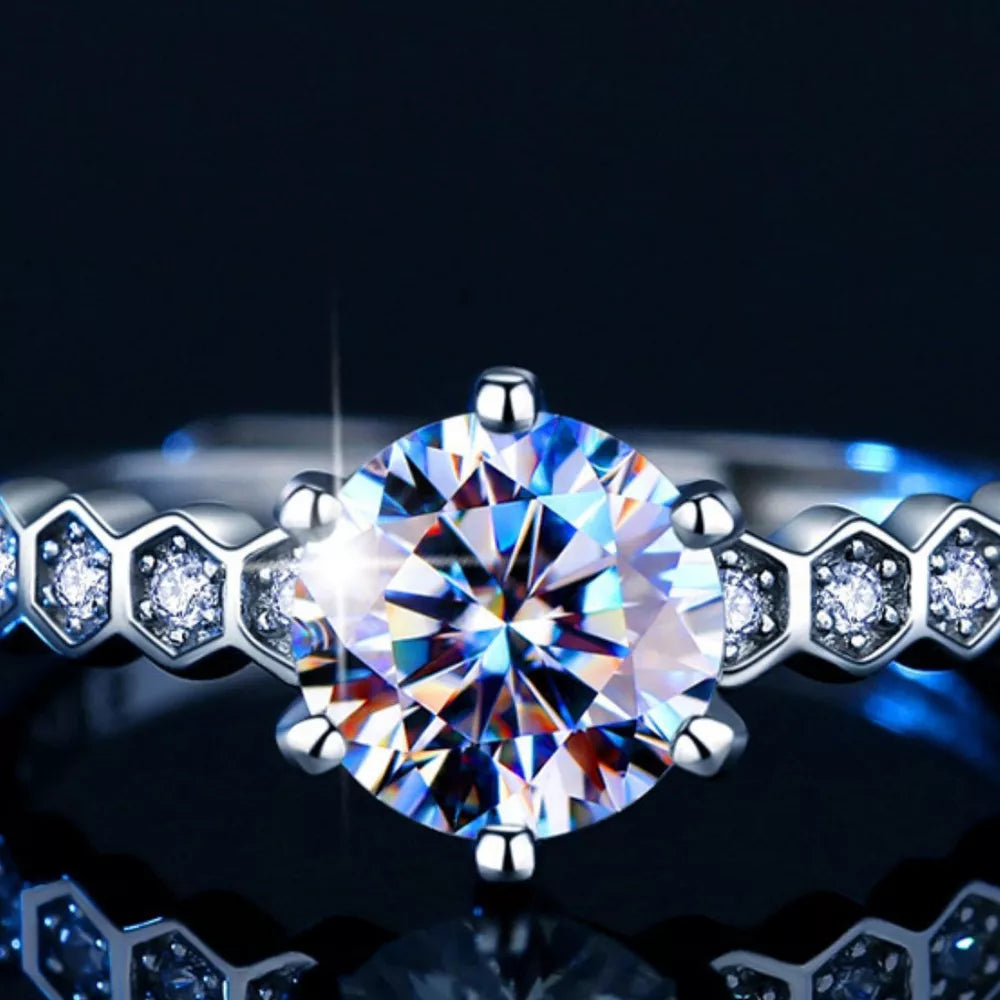 Radiant moissanite silver ring with hexagon band and certificate.