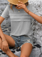 Light gray jersey top with horizontal pleats on the bodice and short sleeves.