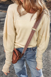 Beige waffle knit colorblock sweatshirt with crew neck and long sleeves.
