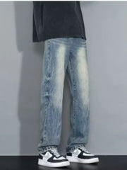 Men's loose-fit jeans in blue wash with distressed details.