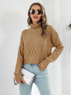 Caramel cable knit cropped turtleneck pullover sweater with chunky knit details.